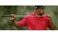 Nike earnings beat Street, stands by Tiger Woods