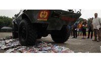 Philippine armoured vehicles destroy counterfeit goods