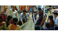 India opens retail sector to foreign brands