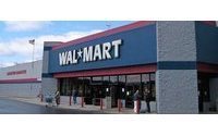 Wal-Mart holiday price cuts hit profits