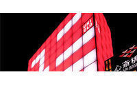 Japan Fast Retailing H1 profit rises, lifts outlook