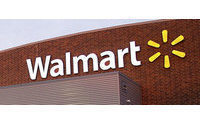 Strong Wal-Mart profit trumps bribery probe concerns