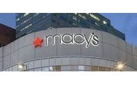 Macy's lowers earnings forecast; to cut jobs