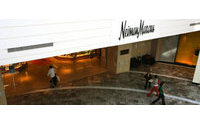 Neiman Marcus' loss narrows as sales rise