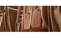 Coach Inc's sales rise for first time in 10 quarters