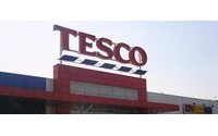 Tesco shows signs of recovery in key home market